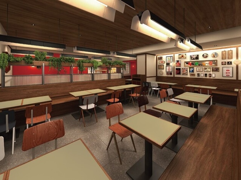 木目調のインテリアと観葉植物が彩る、バル風のおしゃれで活気ある店内です